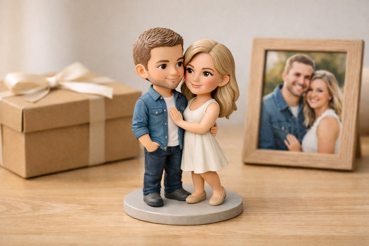 custom couple 3D figurine from photos displayed as a meaningful gift with photo frame and gift box on wooden table
